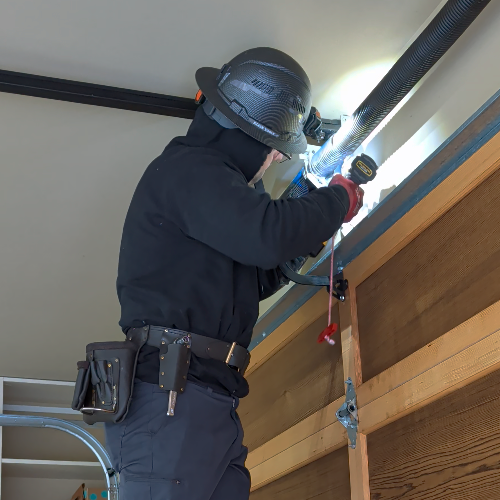 Garage door spring replacement in progress